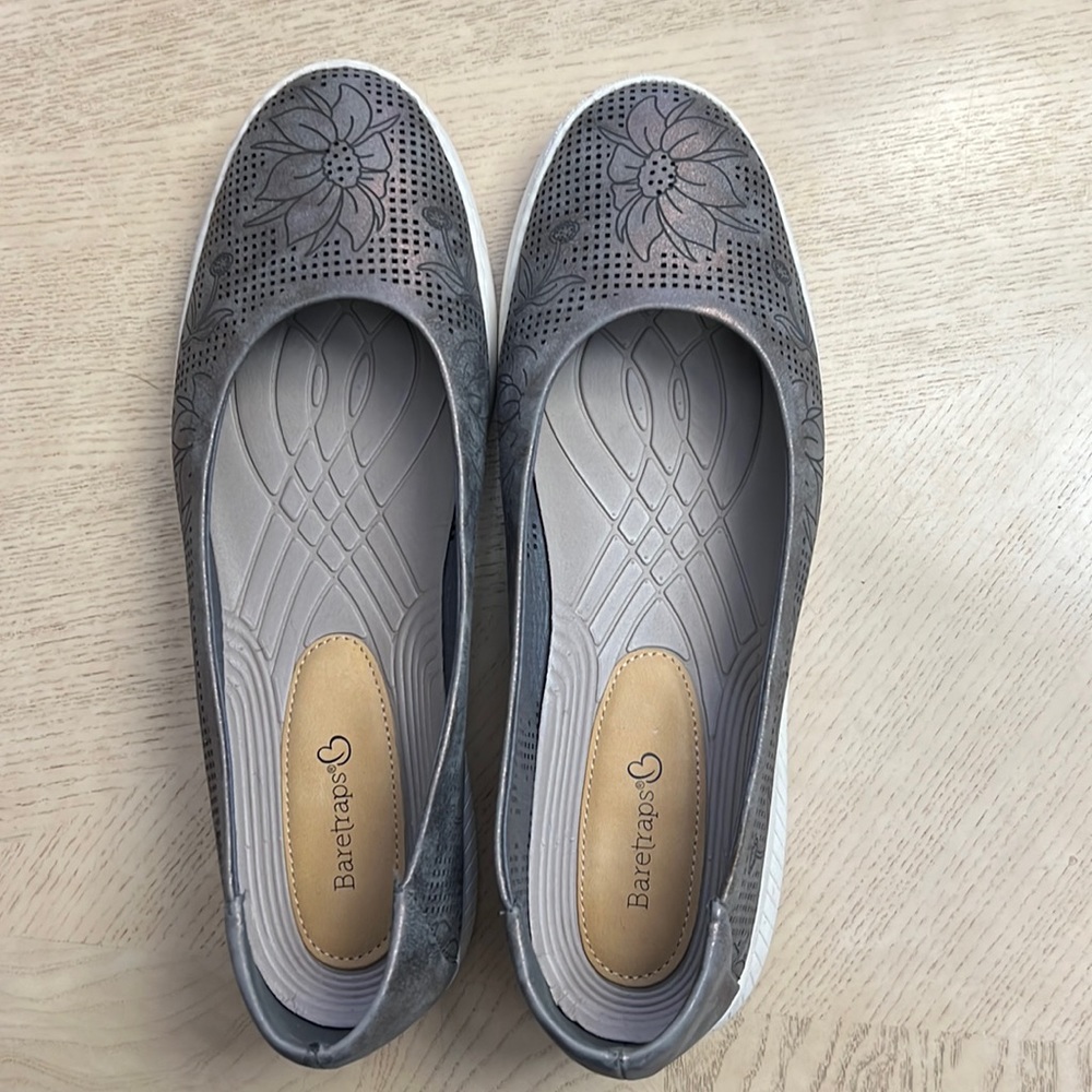 Baretraps are gray/copper Nadra flats. Perforated Floral design. Size 9.5 W